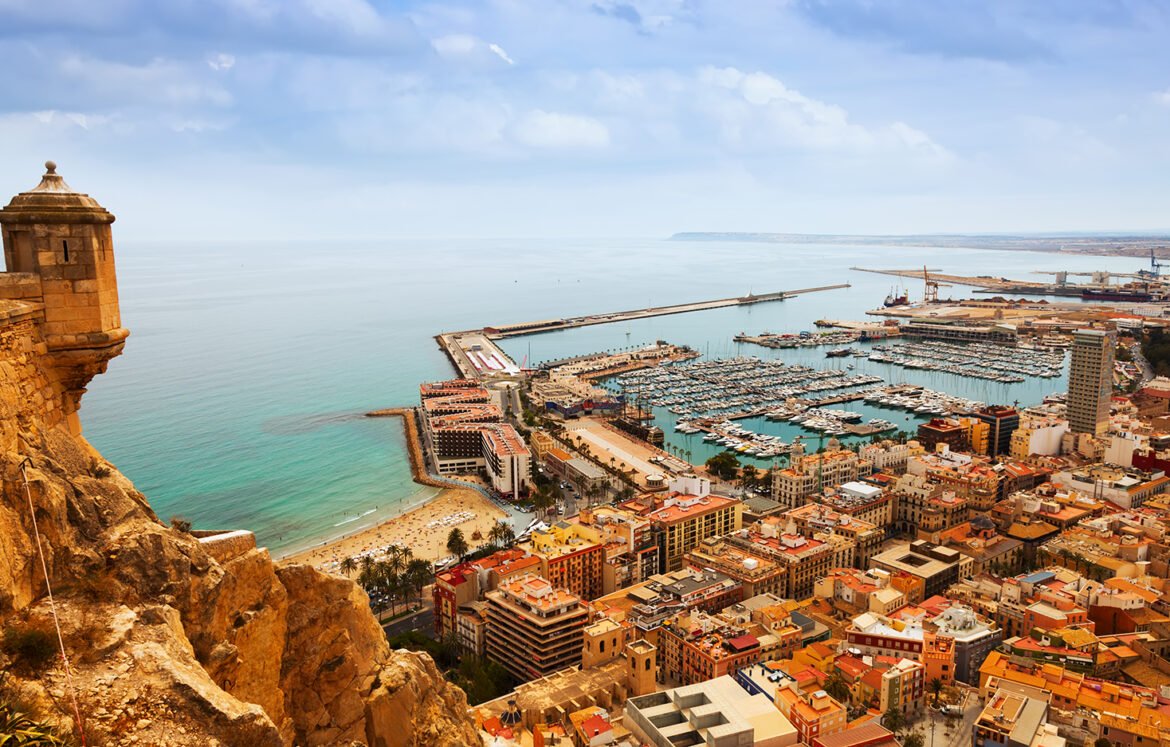 Top view of Port  in Alicante with docked yachts from castle. Spain