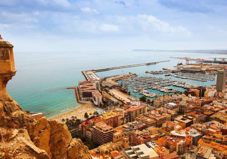 Top view of Port  in Alicante with docked yachts from castle. Spain