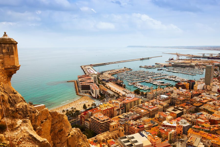 Top view of Port  in Alicante with docked yachts from castle. Spain