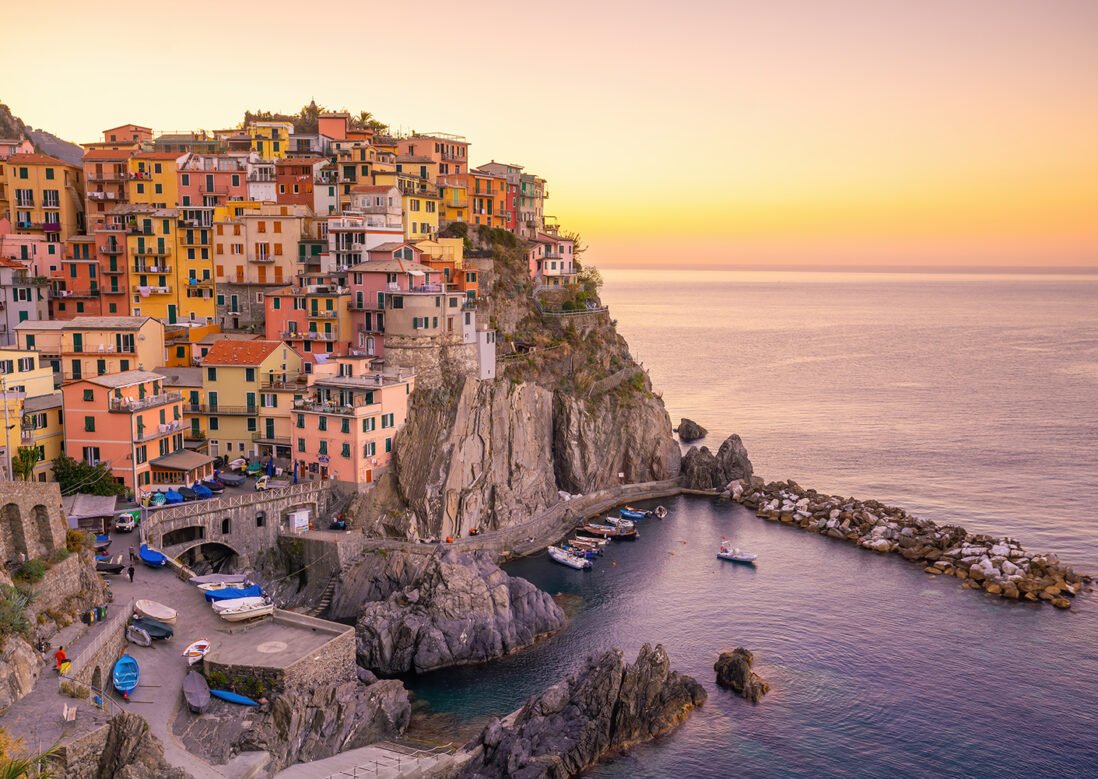 Colorful cityscape of buildings over Mediterranean sea, Europe, Cinque Terre, traditional Italian architecture