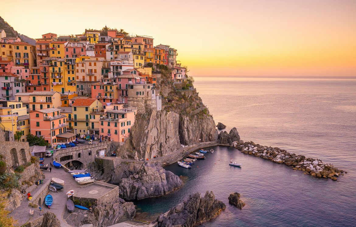 Colorful cityscape of buildings over Mediterranean sea, Europe, Cinque Terre, traditional Italian architecture