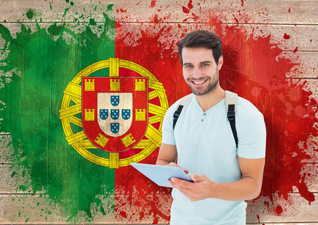 Student using tablet pc against portugal flag in grunge effect