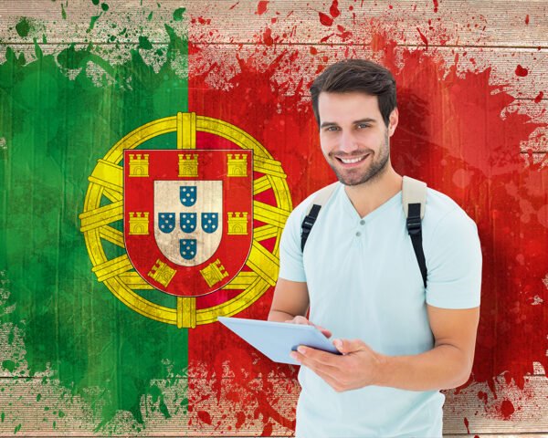 Student using tablet pc against portugal flag in grunge effect