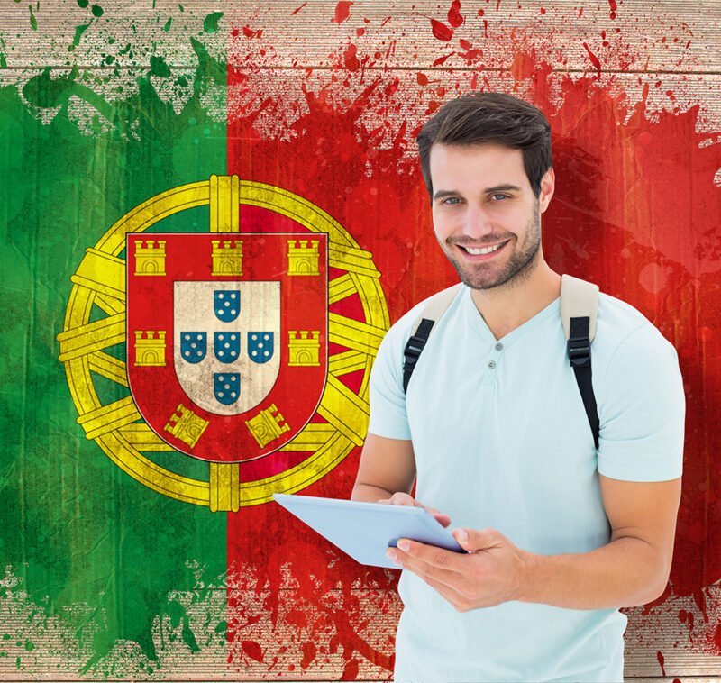 Student using tablet pc against portugal flag in grunge effect Student using tablet pc against portugal flag in grunge effect